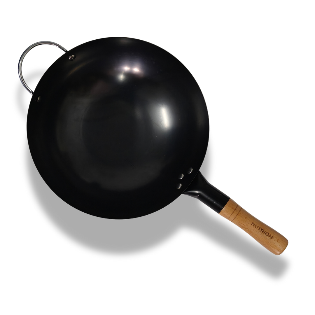 A large carbon steel wok with a wooden handle.